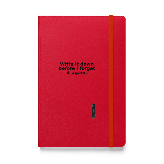 
Red hardcover notebook with yellow elastic band and printed quote: “Wrote it down… then forgot it again.” MISITIS™ brand.