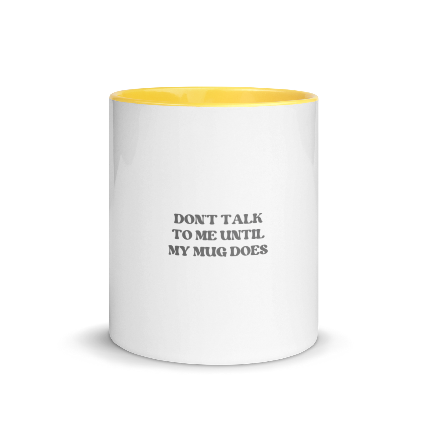 White ceramic mug with yellow inside and black printed text: “DON’T TALK TO ME UNTIL MY MUG DOES.”
