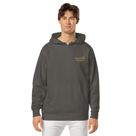 Light gray unisex pigment-dyed hoodie with gold embroidered SKIVENATOR logo on the left chest.
